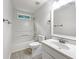 Clean bathroom with a shower-tub combo, a single sink vanity, and neutral finishes at 541 Mckenzie Ave, Stockbridge, GA 30281