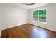 Spacious bedroom with hardwood flooring and a bright window at 541 Mckenzie Ave, Stockbridge, GA 30281