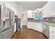 Well-equipped kitchen featuring stainless steel appliances, tiled backsplash, and bright lighting at 541 Mckenzie Ave, Stockbridge, GA 30281