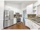 Bright kitchen featuring stainless steel appliances and granite countertops at 541 Mckenzie Ave, Stockbridge, GA 30281