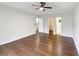 Bright and spacious bedroom featuring hardwood floors, ceiling fan and convenient access to closets at 541 Mckenzie Ave, Stockbridge, GA 30281