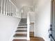 Interior shot of staircase with wood steps and white railings at 541 Mckenzie Ave, Stockbridge, GA 30281