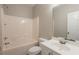 Compact bathroom featuring a tub/shower combo and a single sink vanity at 6053 Park Close, Fairburn, GA 30213