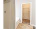 Bright bathroom with shower, soaking tub, and walk-in closet at 6053 Park Close, Fairburn, GA 30213
