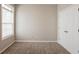 Bedroom featuring neutral walls and flooring, closet space, and a window for lots of natural light at 6053 Park Close, Fairburn, GA 30213
