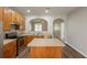 Bright kitchen boasts granite counters, stainless appliances, and a convenient center island at 6053 Park Close, Fairburn, GA 30213