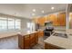 Modern kitchen with stainless appliances, kitchen island, and breakfast nook with many windows at 6053 Park Close, Fairburn, GA 30213
