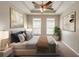 Tranquil main bedroom features tray ceilings, recessed lighting, and calming decor at 6053 Park Close, Fairburn, GA 30213
