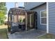 Backyard with covered patio featuring black metal frame, netting, and outdoor seating at 2341 Lily Valley Dr, Lawrenceville, GA 30045