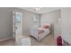 Cozy bedroom featuring a white bed frame, neutral walls, two windows and carpeted floors at 2341 Lily Valley Dr, Lawrenceville, GA 30045