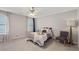 Inviting bedroom features carpet, ceiling fan and dual windows offering ample natural light and comfort at 2341 Lily Valley Dr, Lawrenceville, GA 30045