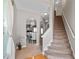 An elegant foyer with a staircase, arched doorways, and a view into the dining room at 2341 Lily Valley Dr, Lawrenceville, GA 30045