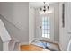 A welcoming foyer with a staircase and stylish door at 2341 Lily Valley Dr, Lawrenceville, GA 30045