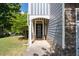Charming entryway featuring a stylish front door, stone accents, and well-maintained landscaping at 2341 Lily Valley Dr, Lawrenceville, GA 30045