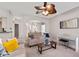 Cozy living room with comfortable seating, a modern piano, and neutral paint at 2341 Lily Valley Dr, Lawrenceville, GA 30045