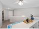Neutral loft features a ceiling fan, recessed lights, and natural light that enhances the space's versatility at 2341 Lily Valley Dr, Lawrenceville, GA 30045