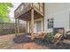 Exterior view of property with open porch, patio furniture and mature trees at 285 Enterprise Path, Hiram, GA 30141