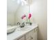 Bathroom featuring an extended white vanity, with a large mirror, and modern light fixture at 285 Enterprise Path, Hiram, GA 30141