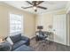 Inviting bedroom with desk area, perfect for work or study, and a comfortable blue couch at 285 Enterprise Path, Hiram, GA 30141