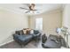 Cozy bedroom with desk area, perfect for work or study, and a comfortable blue couch at 285 Enterprise Path, Hiram, GA 30141