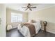 Bright bedroom features a ceiling fan and plush bedding for a peaceful retreat at 285 Enterprise Path, Hiram, GA 30141