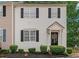 Charming two-story home featuring white siding, black shutters, and well-maintained landscaping at 285 Enterprise Path, Hiram, GA 30141