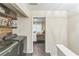 Hallway featuring laundry units leading into bedroom with neutral decor and ample lighting at 285 Enterprise Path, Hiram, GA 30141