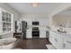 This is a kitchen with stainless appliances, white cabinets, and dark wood floors at 285 Enterprise Path, Hiram, GA 30141