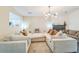 Cozy living room featuring a fireplace, modern lighting, and a plush, oversized sectional sofa at 285 Enterprise Path, Hiram, GA 30141