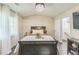 Comfortable main bedroom featuring a modern chandelier, neutral tones, and bright natural light at 285 Enterprise Path, Hiram, GA 30141