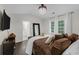 Bright and airy main bedroom with a chandelier, mounted TV, and an ensuite bathroom at 285 Enterprise Path, Hiram, GA 30141