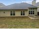Backyard view of the home showing the patio and the expansive yard at 403 Vinings Vintage Cir, Mableton, GA 30126