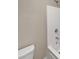 Clean bathroom featuring a toilet and a tub-shower combination with white fixtures at 403 Vinings Vintage Cir, Mableton, GA 30126