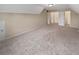 Vast bonus room with neutral carpet, natural light, and white doors at 403 Vinings Vintage Cir, Mableton, GA 30126