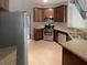 Well-equipped kitchen with stainless steel appliances and wood cabinetry at 403 Vinings Vintage Cir, Mableton, GA 30126