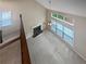 Bright living room with a fireplace, large windows, and a ceiling fan at 403 Vinings Vintage Cir, Mableton, GA 30126