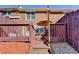 Fenced backyard features a patio, a deck, and well-kept landscaping at 6118 Queen Anne Ct, Norcross, GA 30093