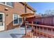 Charming backyard patio with umbrella, outdoor seating, and grill surrounded by a privacy fence at 6118 Queen Anne Ct, Norcross, GA 30093