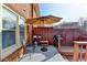 Inviting backyard patio with umbrella, outdoor seating, and grill, perfect for outdoor entertaining at 6118 Queen Anne Ct, Norcross, GA 30093