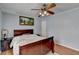 Comfortable bedroom boasting hard wood floors and a ceiling fan at 6118 Queen Anne Ct, Norcross, GA 30093