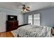 Cozy bedroom featuring a ceiling fan, neutral walls, and carpet flooring at 6118 Queen Anne Ct, Norcross, GA 30093
