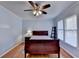 Comfortable bedroom with hardwood floors, neutral walls, and a ceiling fan at 6118 Queen Anne Ct, Norcross, GA 30093