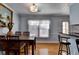 Inviting dining room featuring a wood table, four chairs, and natural light from a window at 6118 Queen Anne Ct, Norcross, GA 30093