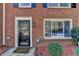 Close-up of front door with detailed trim and a view reflected in the glass at 6118 Queen Anne Ct, Norcross, GA 30093