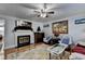 Inviting living room featuring a fireplace, hardwood floors, and comfortable seating at 6118 Queen Anne Ct, Norcross, GA 30093