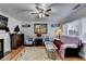 Inviting living room featuring a fireplace, hardwood floors, and comfortable seating at 6118 Queen Anne Ct, Norcross, GA 30093