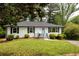 Charming home featuring a well-manicured lawn and a welcoming light blue front door at 2834 Vicksburg Ct, Decatur, GA 30034