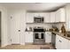 Well-equipped kitchen with stainless steel appliances, ample cabinet space, and sleek countertops at 2834 Vicksburg Ct, Decatur, GA 30034