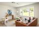 Well-lit living room with sleek furniture, modern decor, and a large window view at 2834 Vicksburg Ct, Decatur, GA 30034