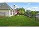 Lush, fenced backyard with a patio area, perfect for outdoor entertaining at 380 Vista Creek Dr, Stockbridge, GA 30281